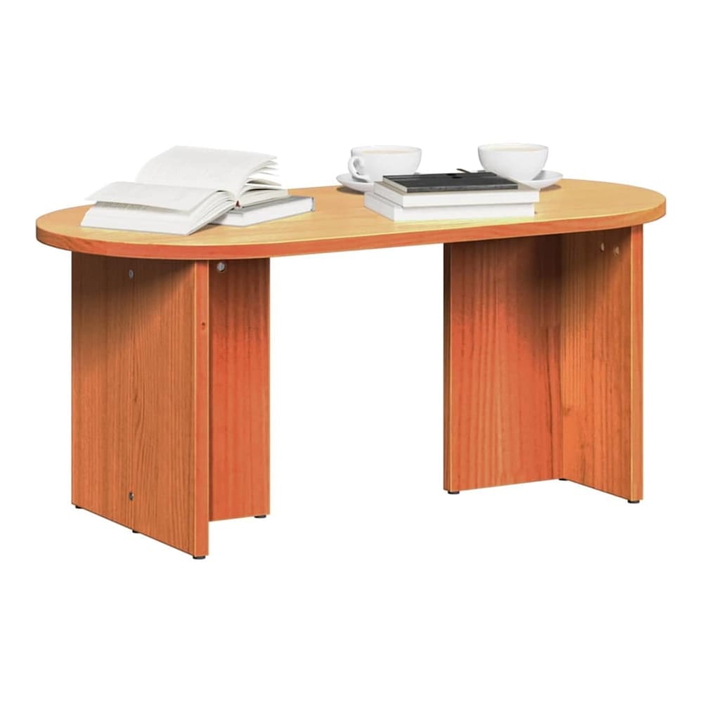 coffee table with books and cups on top, set against a neutral background