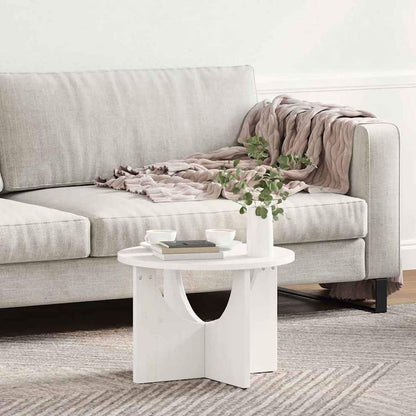 White coffee table placed beside a sofa with a throw blanket draped over it