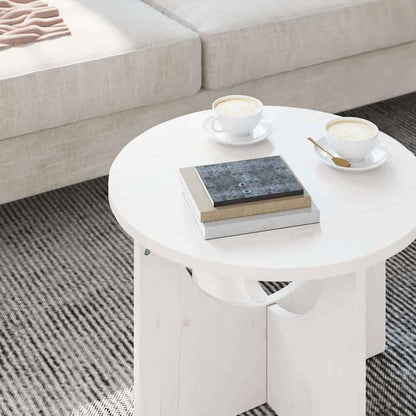 Close-up of the white coffee table surface with books and cups