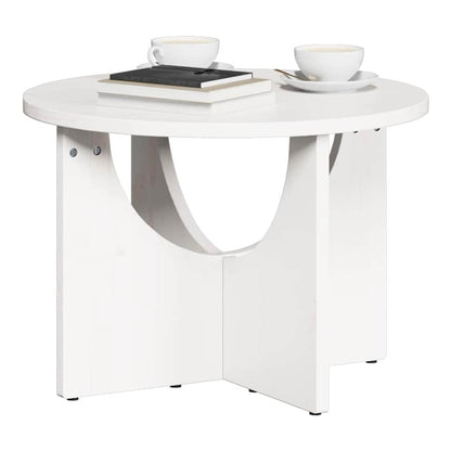 White coffee table with two cups of coffee and a book on top