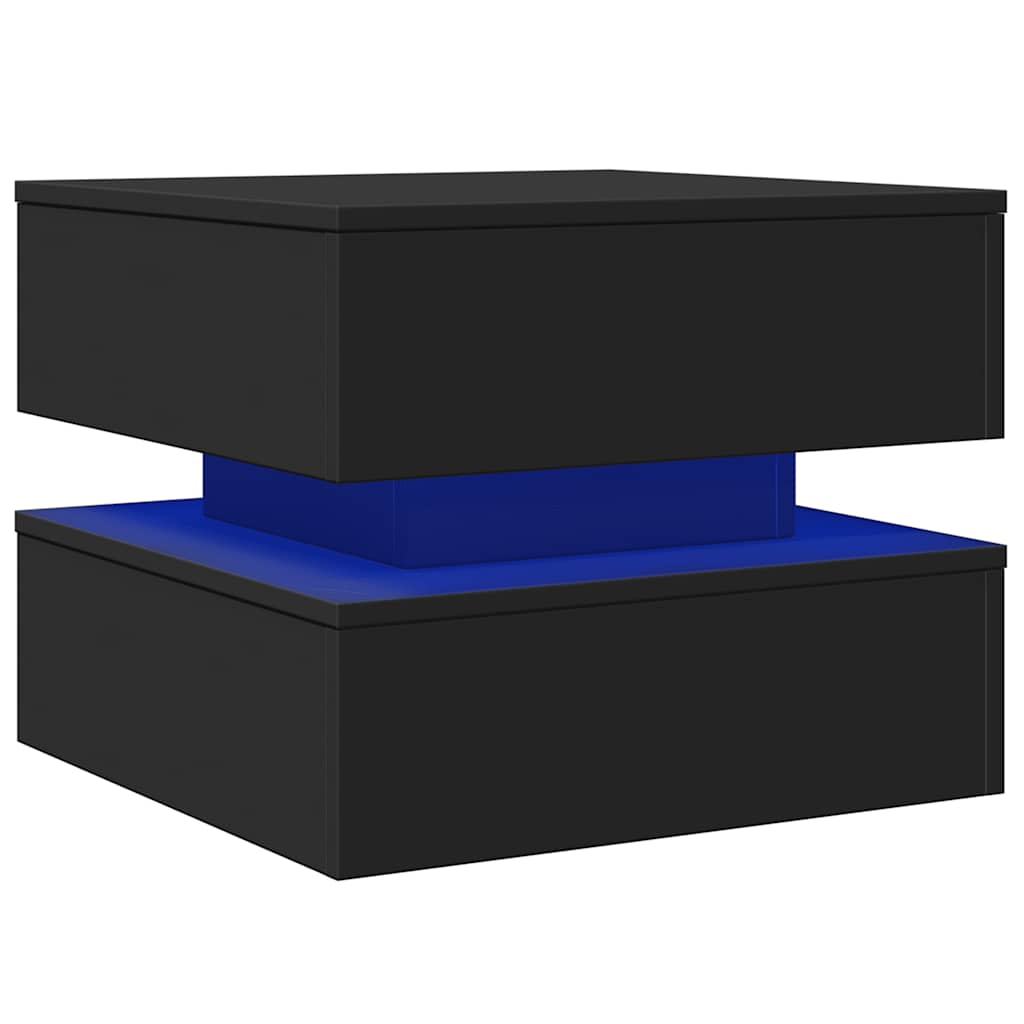 Black coffee table with blue LED lighting underneath, showing its modern design