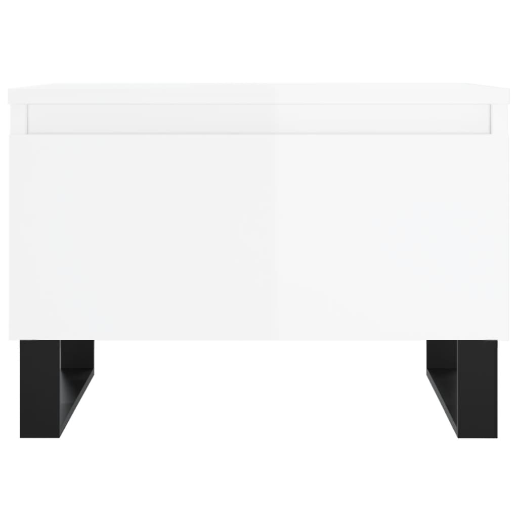 The back of a white high gloss coffee table with black metal legs