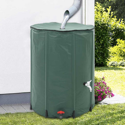 vidaXL Collapsible Rain Water Tank 500 L standing on grass next to a wall with water flowing in from a pipe