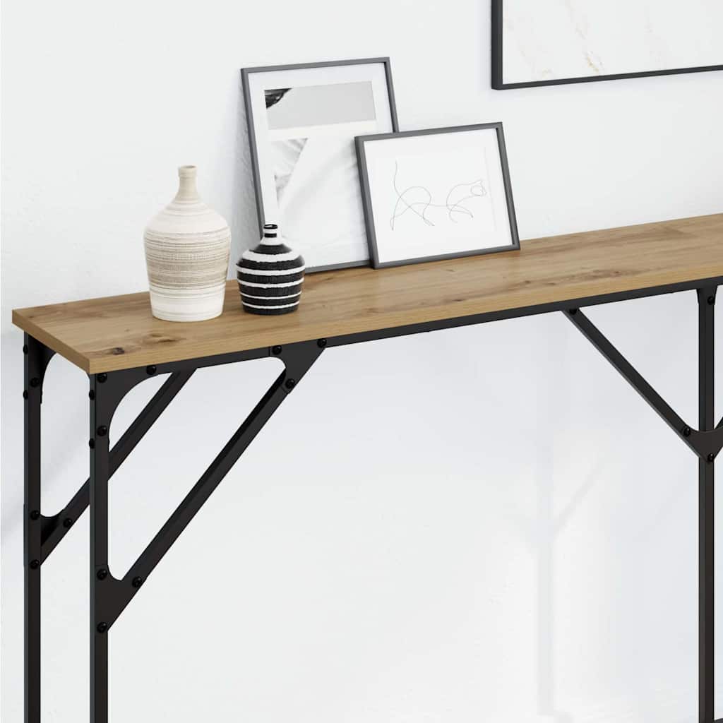 Close up of the wooden top and black metal frame of the console table