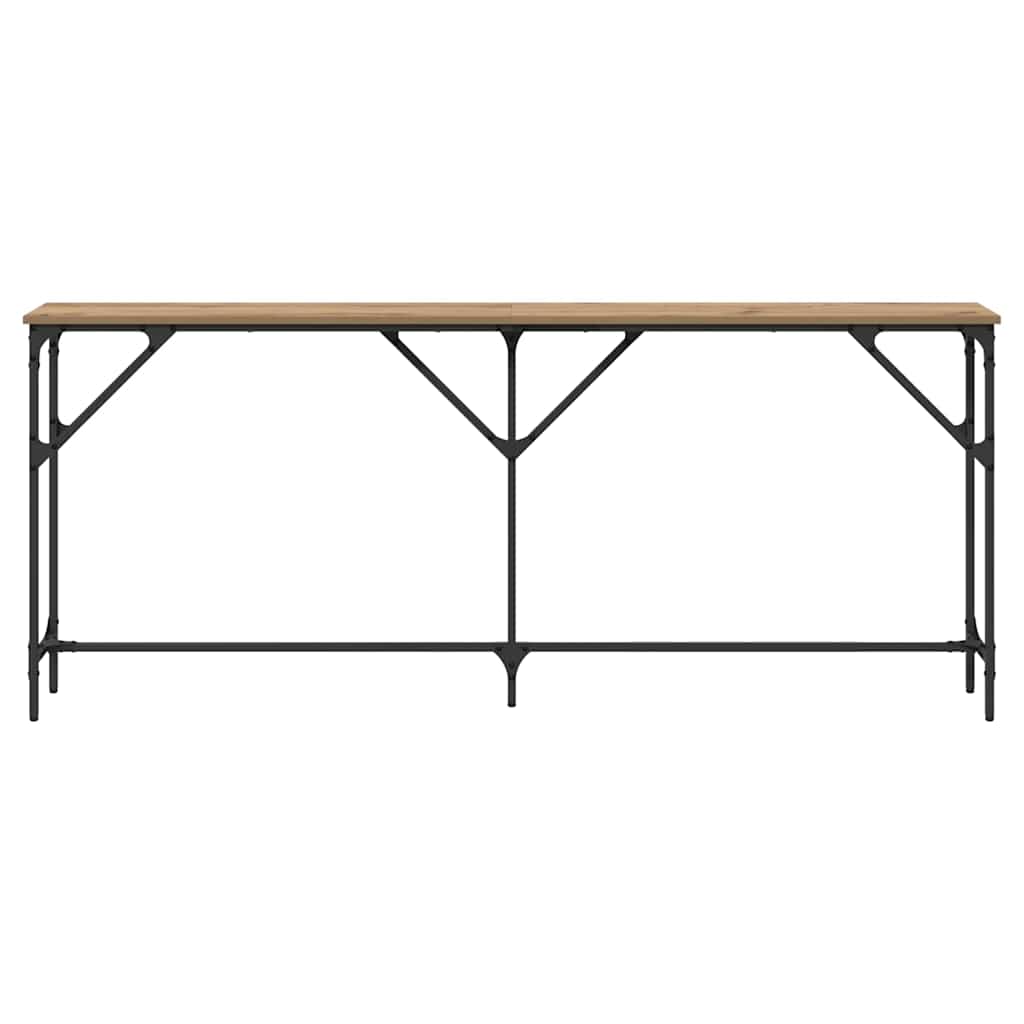 A console table with a wooden top and black metal legs, shown against a white wall