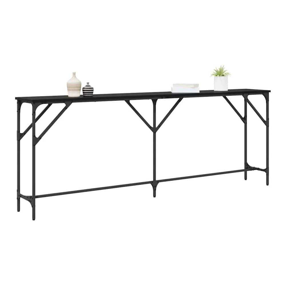 The black oak console table displayed with decorative items on top