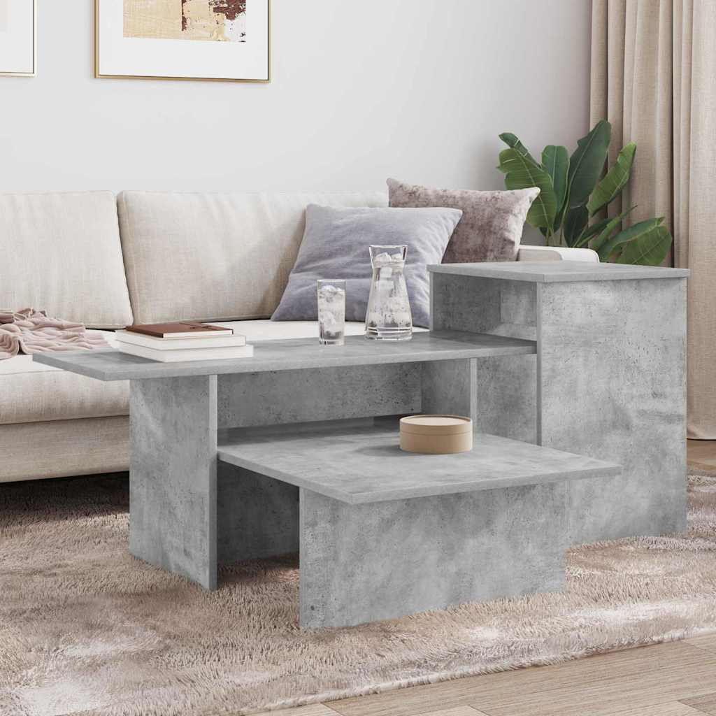 A concrete grey console table in a lounge with drinks and plant