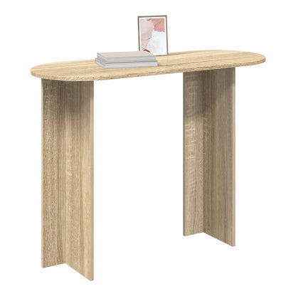 A narrow console table with a sonoma oak finish and oval top