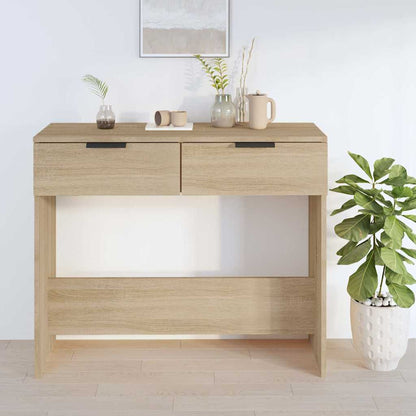 The end table styled with decorative items and a potted plant in a modern living space