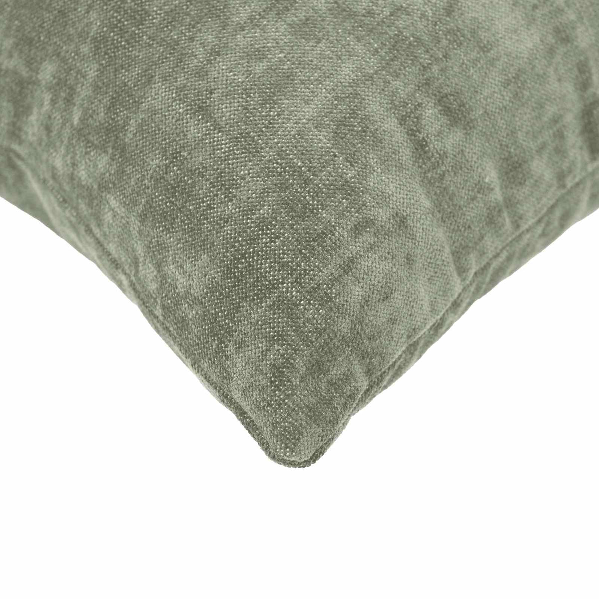Close-up of the corner of a green chenille cushion cover showing texture