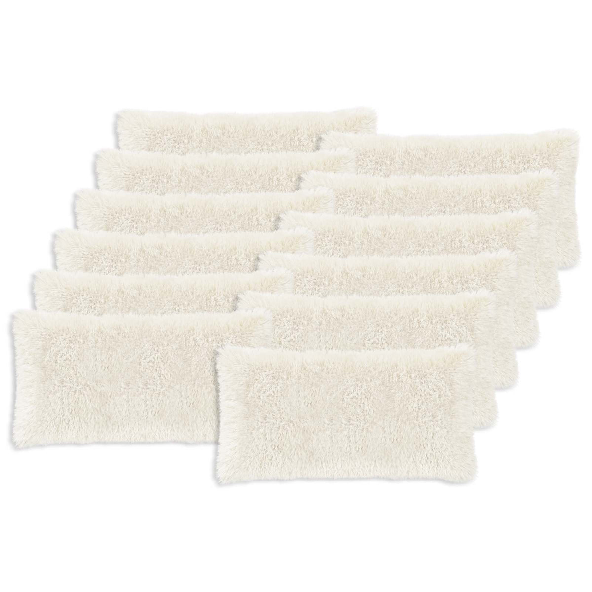 A pack of twelve white fluffy cushion covers laid out