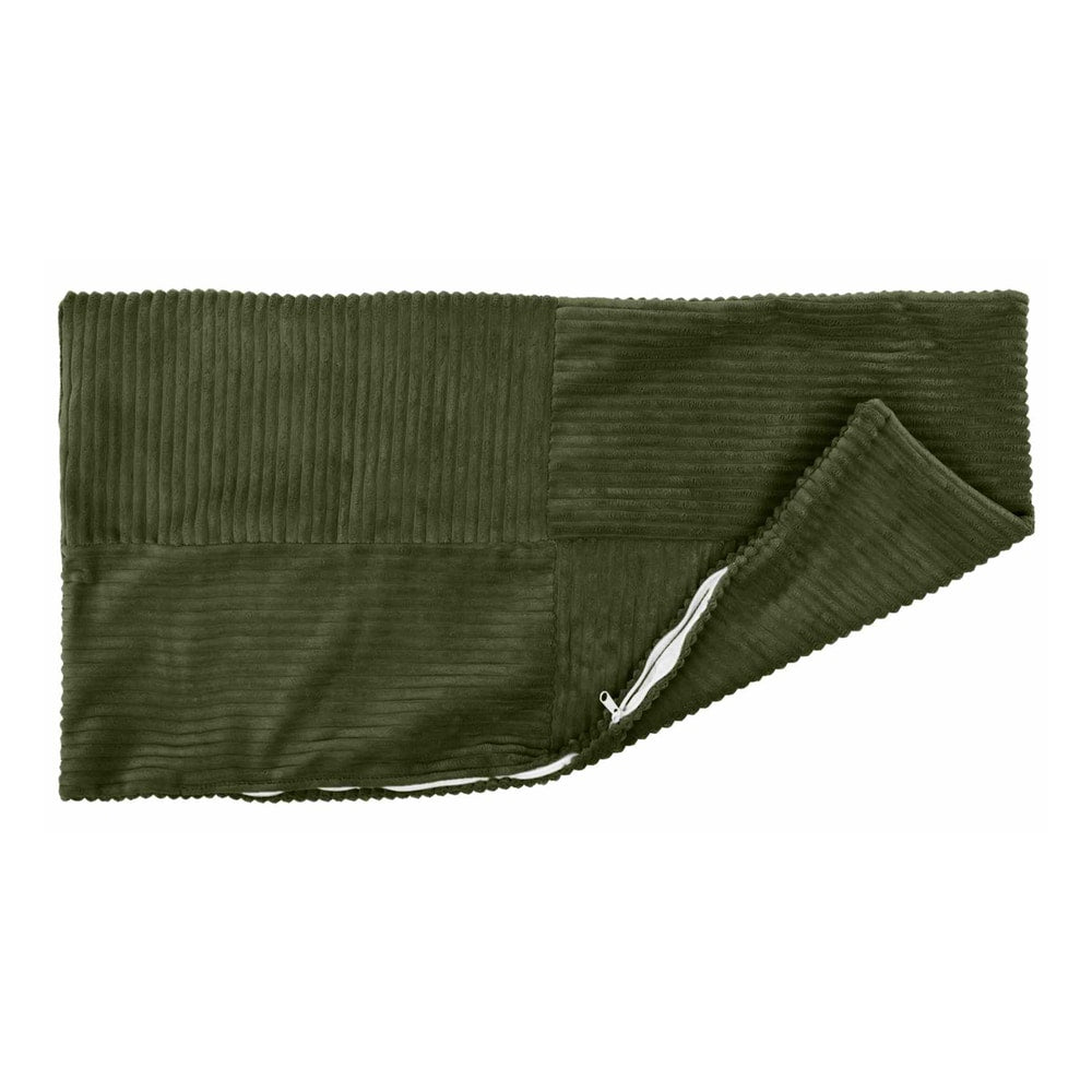 The green corduroy pillowcase is opened with a zipper to show the inside