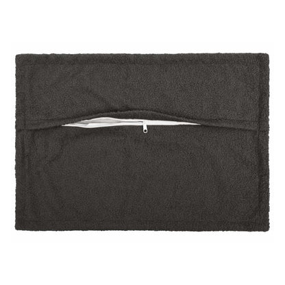 The dark grey bouclé pillowcase shows its zip closure on the back
