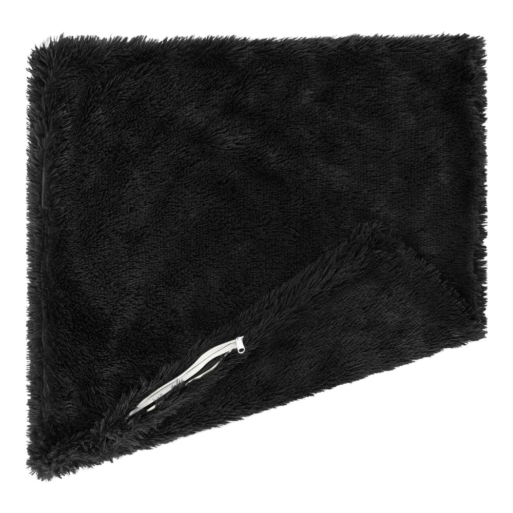A black fluffy cushion cover folded, showing a zip fastener