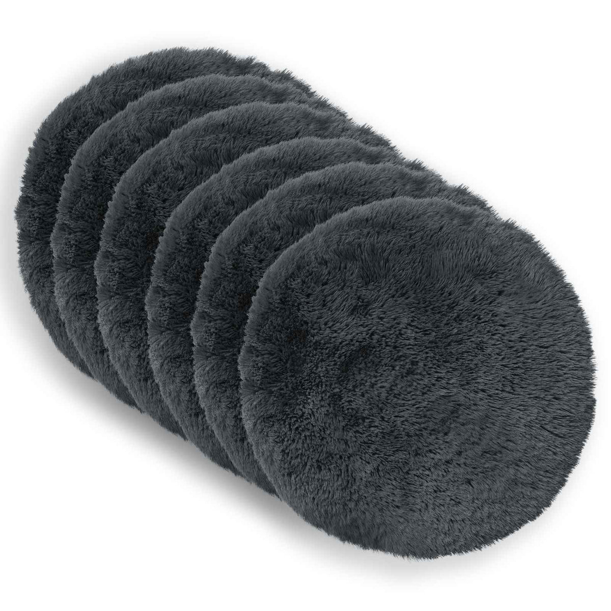 six round grey cushions stacked on a white surface