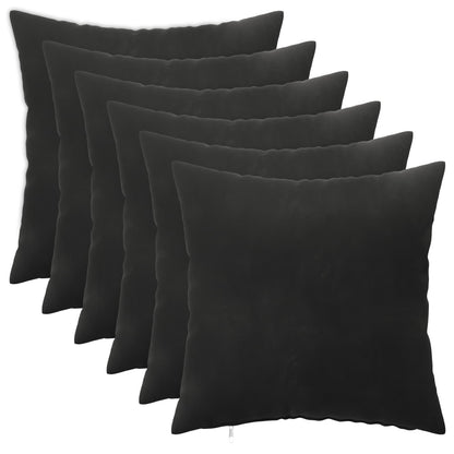 Six black velvet cushions arranged in a fan shape