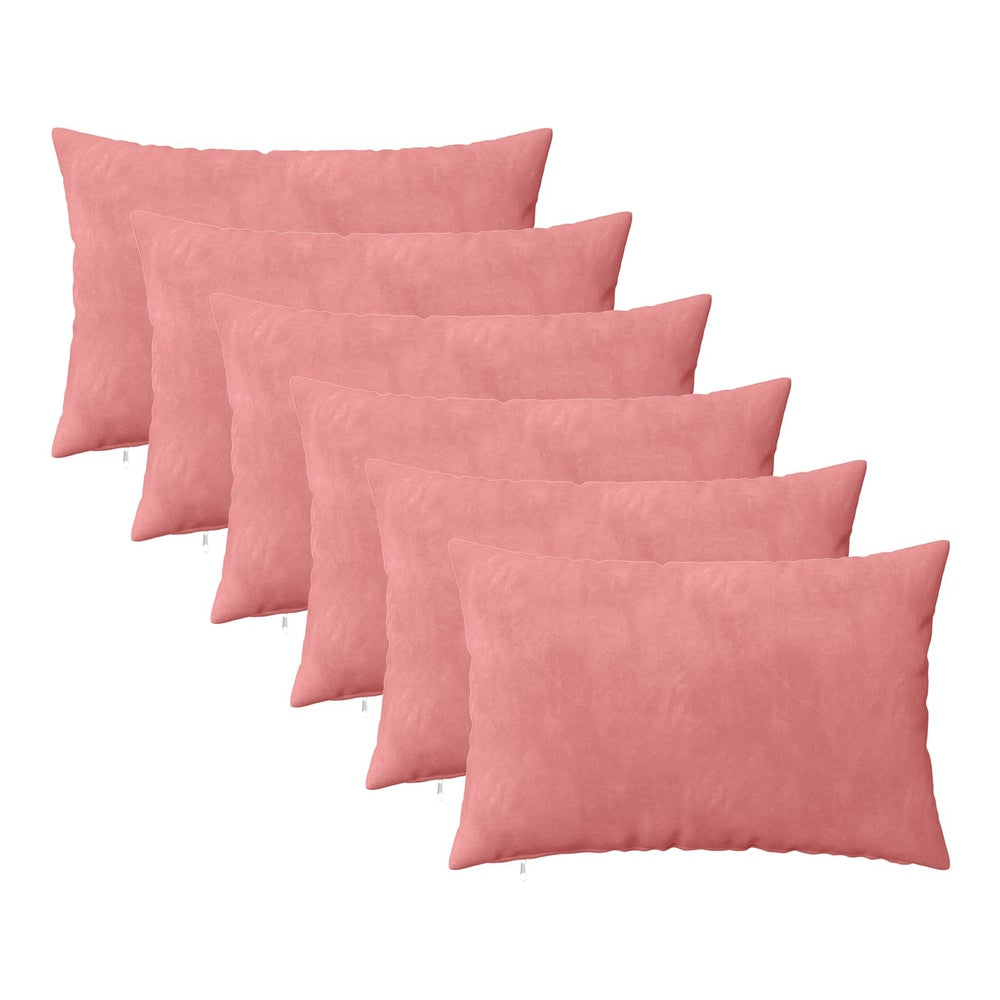 six pink velvet cushions arranged in a fan shape