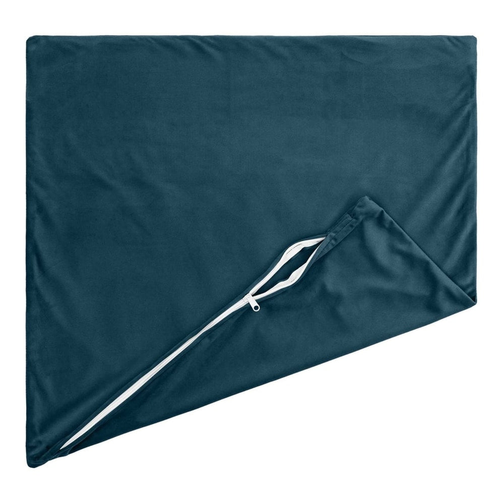 A blue velvet cushion cover laid flat, showing the zip opening