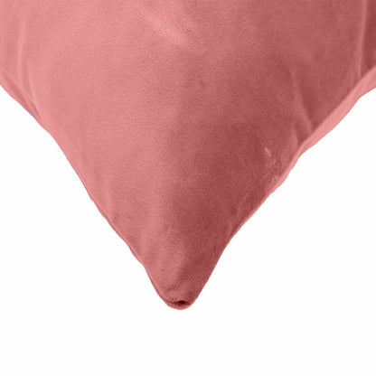 close up of the corner of a pink velvet cushion