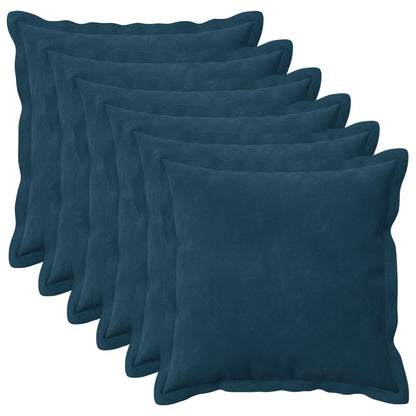 Six blue velvet cushions arranged in a fan shape