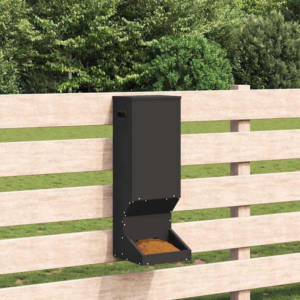 the black steel deer feeder attached to a wooden fence