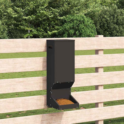 the black steel deer feeder attached to a wooden fence