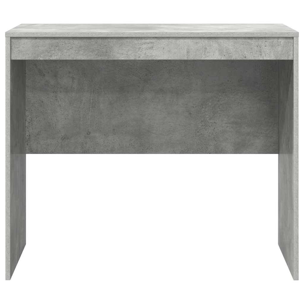 Back view of the concrete grey desk showing its simple structure
