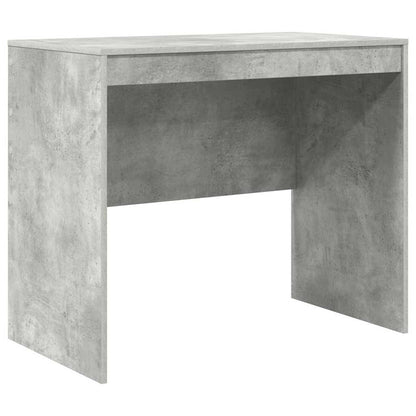 A concrete grey desk with a simple rectangular design and open leg space
