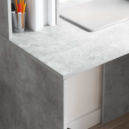 The concrete grey desk showing the textured surface and a small drawer opening