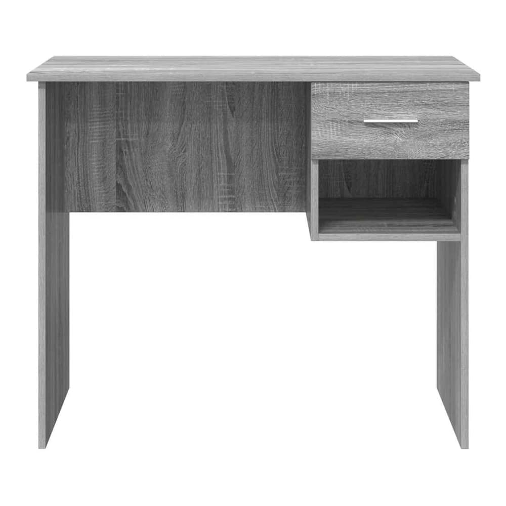 A straight-on view of the grey engineered wood desk, showing its compact size and shelving unit