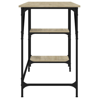 The desk has a light wood effect top and two shelves with black metal legs and frame