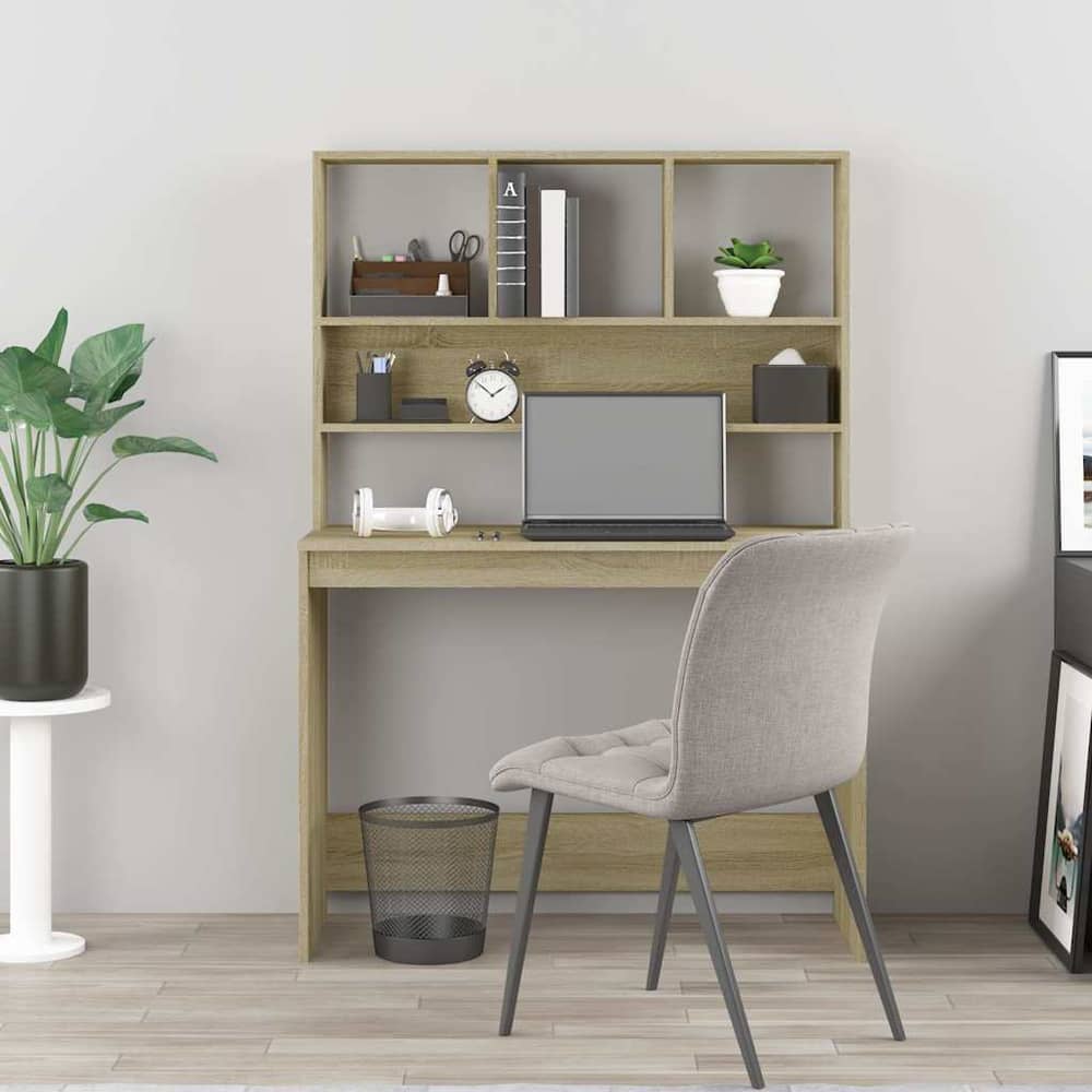 This desk with shelves is shown in a room with a chair and accessories on the desk