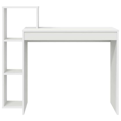 White engineered wood desk with a tall shelving unit on the left