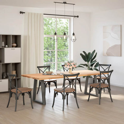 Two anthracite steel V-shaped table legs used to support a wooden dining table with chairs in a room
