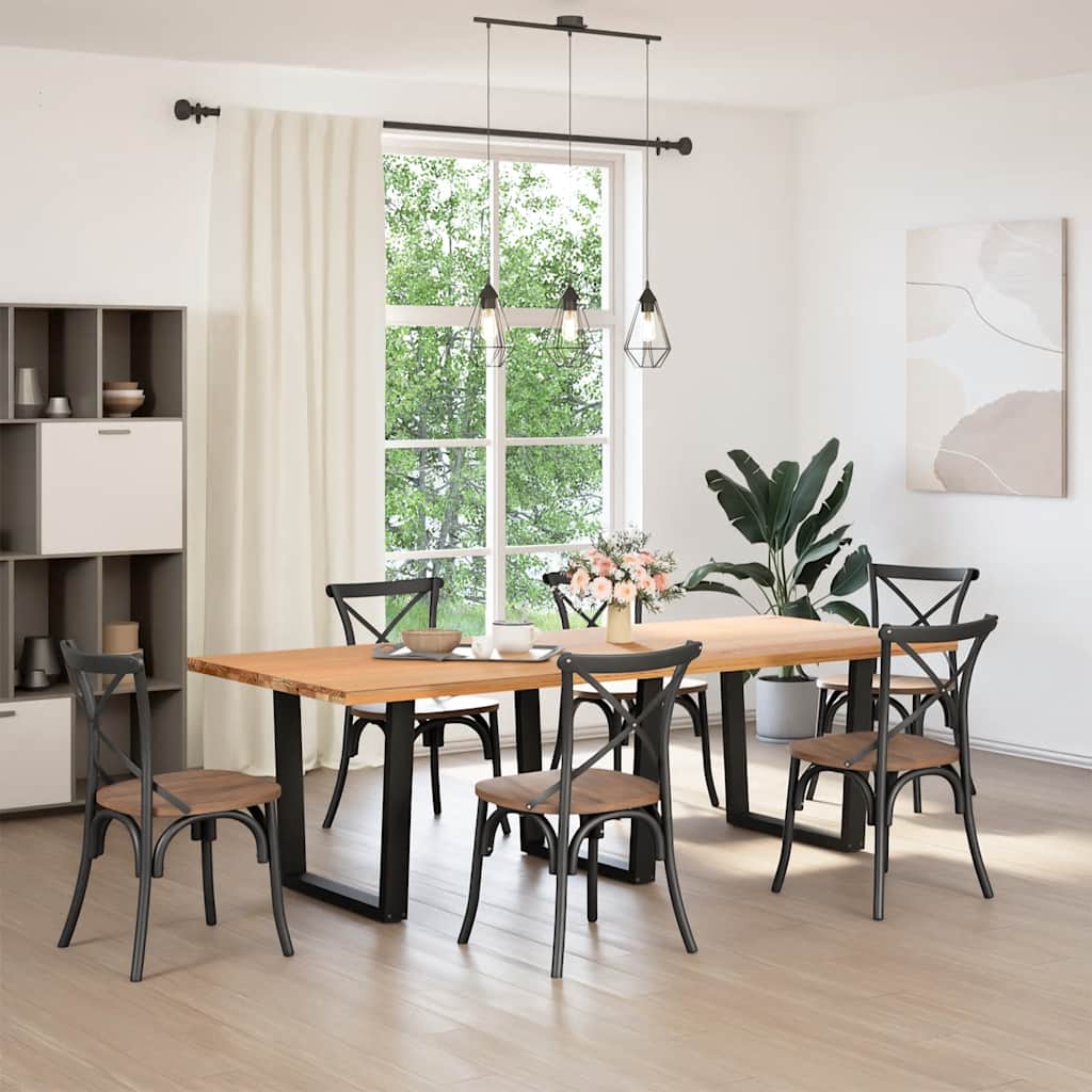 The dining table legs are shown supporting a wooden table in a dining room setting