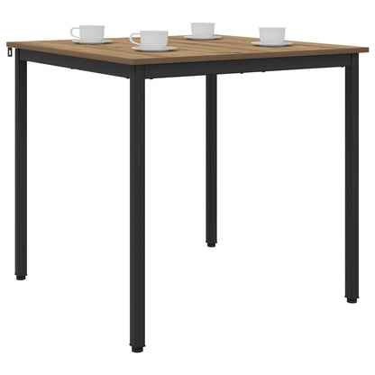 The dining table with four cups and saucers on top