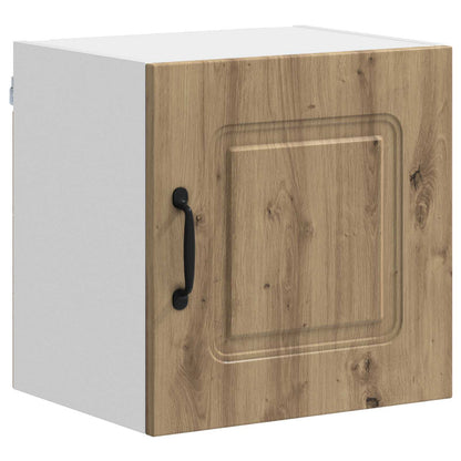 A single kitchen cabinet with an artisan oak effect door and black handle