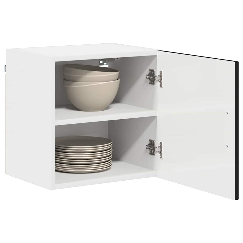 The dishwasher panel with the door open revealing two white shelves holding bowls and plates