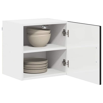 The dishwasher panel with the door open revealing two white shelves holding bowls and plates