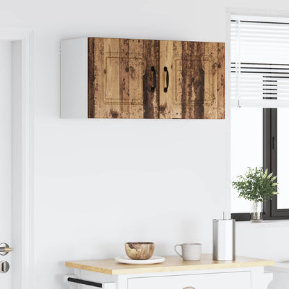 Kitchen cabinets with rustic wood effect doors mounted on a wall above a counter