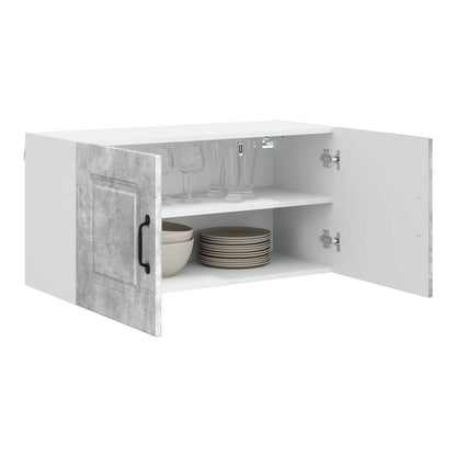 open concrete grey kitchen cabinet showing two shelves and dishes inside