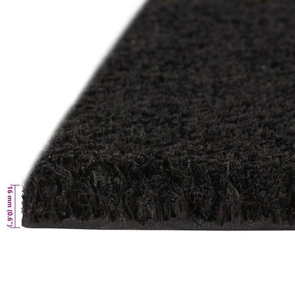 Side profile of the black tufted coir doormat showing its thickness