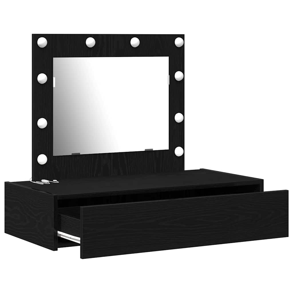 Black dressing table with an open drawer and a mirror with lights
