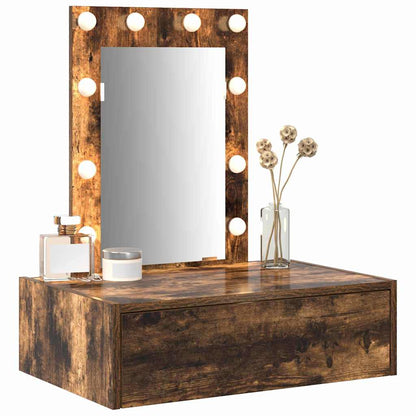 The dressing table featuring a mirror with lights and decorative items placed on the surface