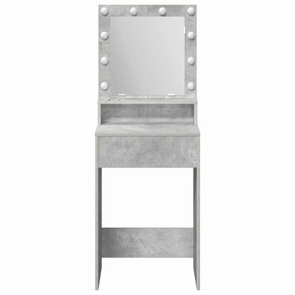 The concrete grey dressing table with illuminated mirror and drawer, from the front