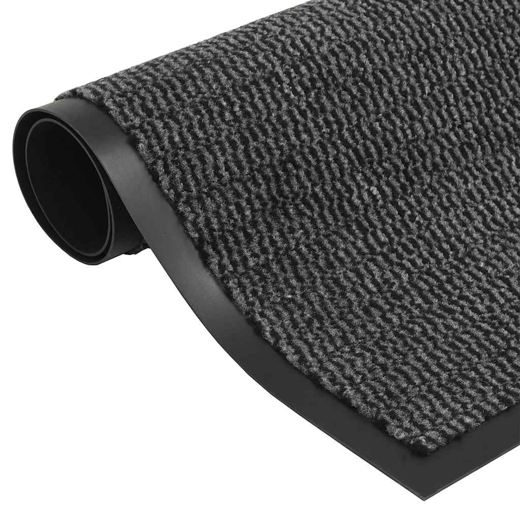 The door mats showing the textured tufted surface and smooth black rubber border
