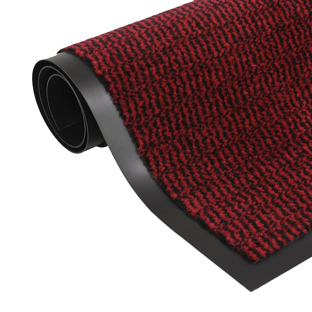 The door mats with a red and black tufted surface and a smooth black border