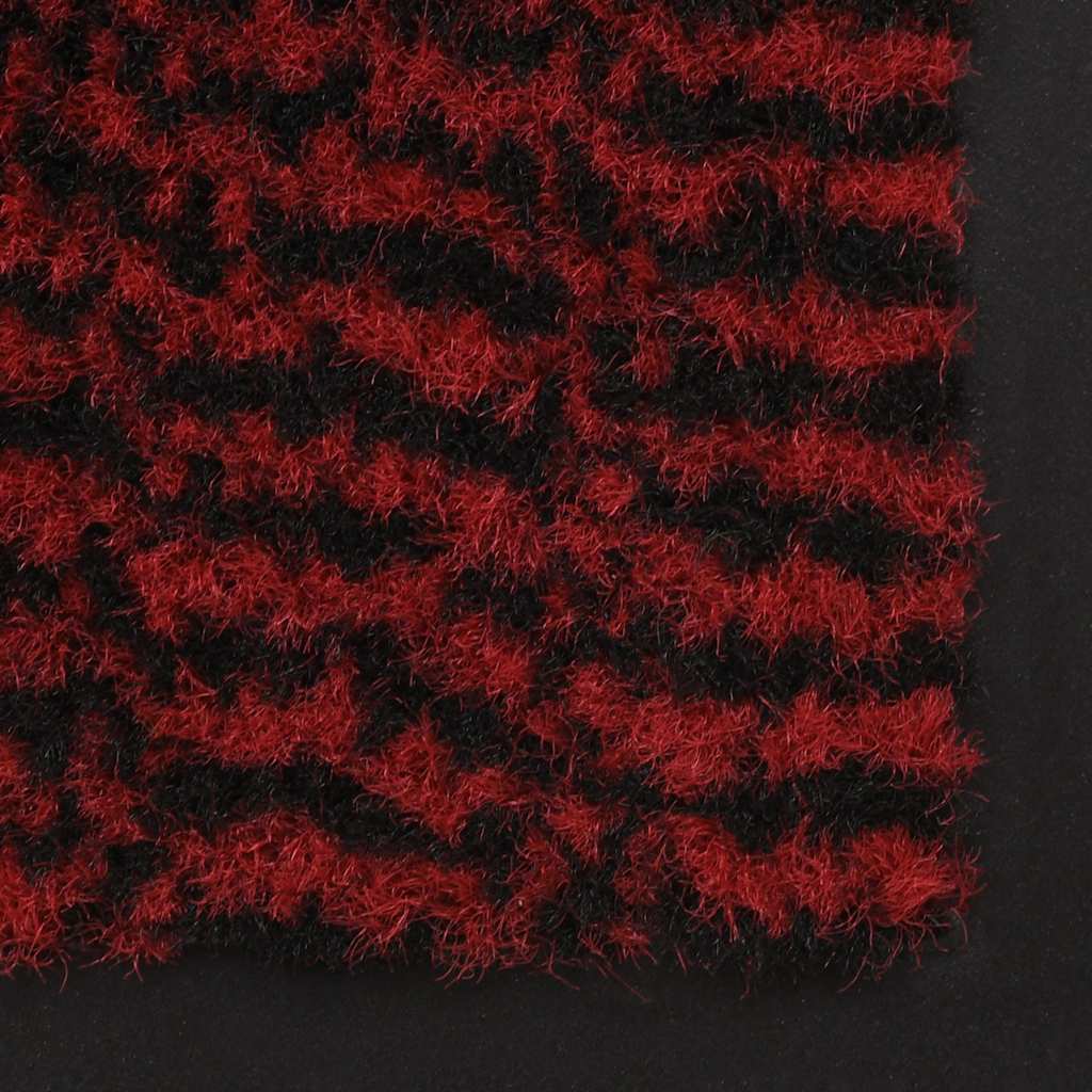 The door mats showing a close up of the red and black tufted texture