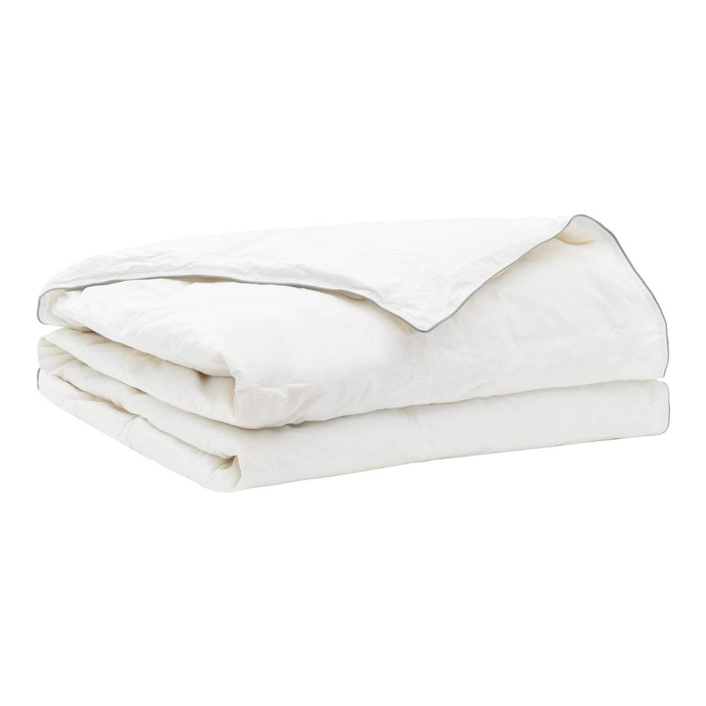 The white duvet folded neatly to show the quilted pattern and stitched edges