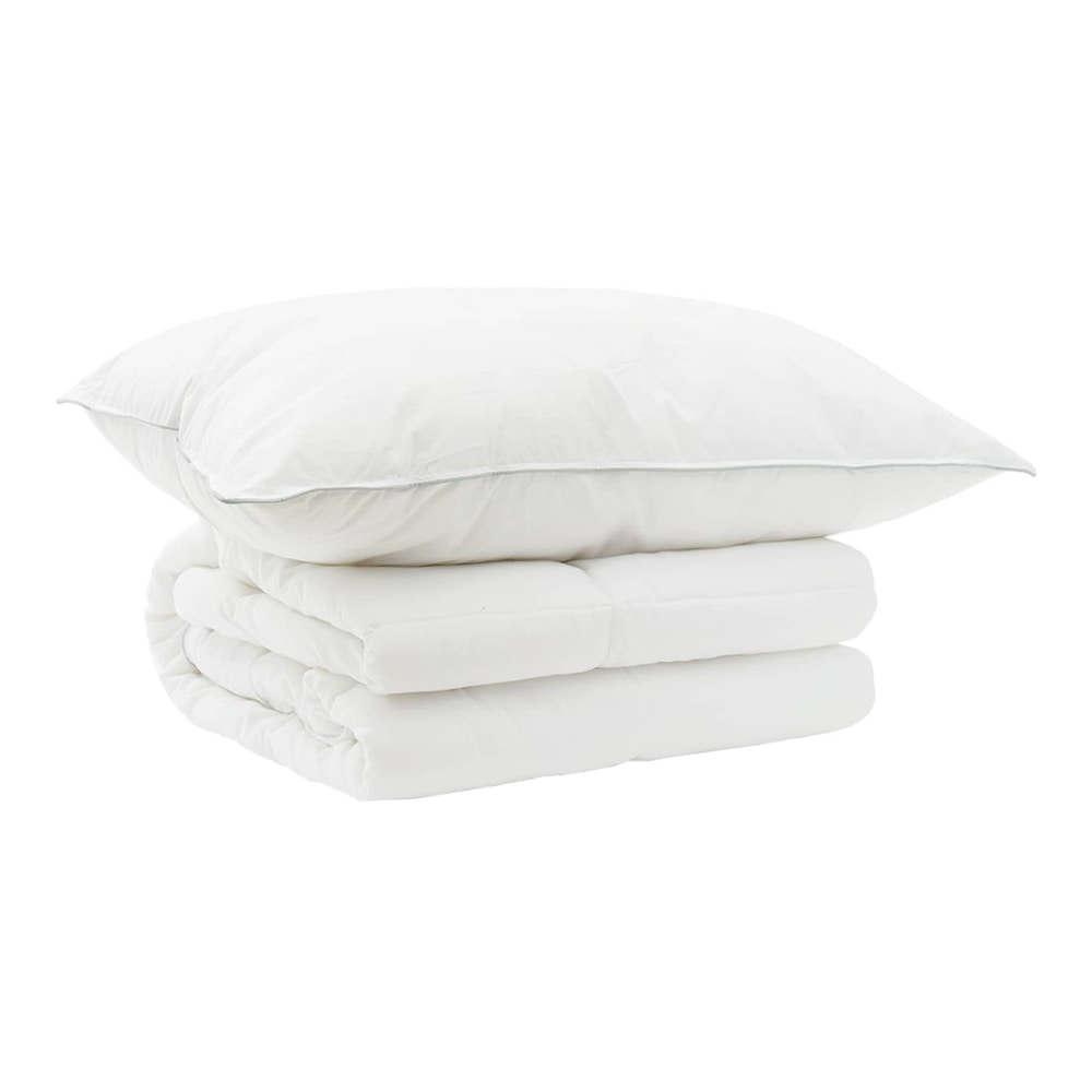 A white pillow and a folded white duvet on top of each other